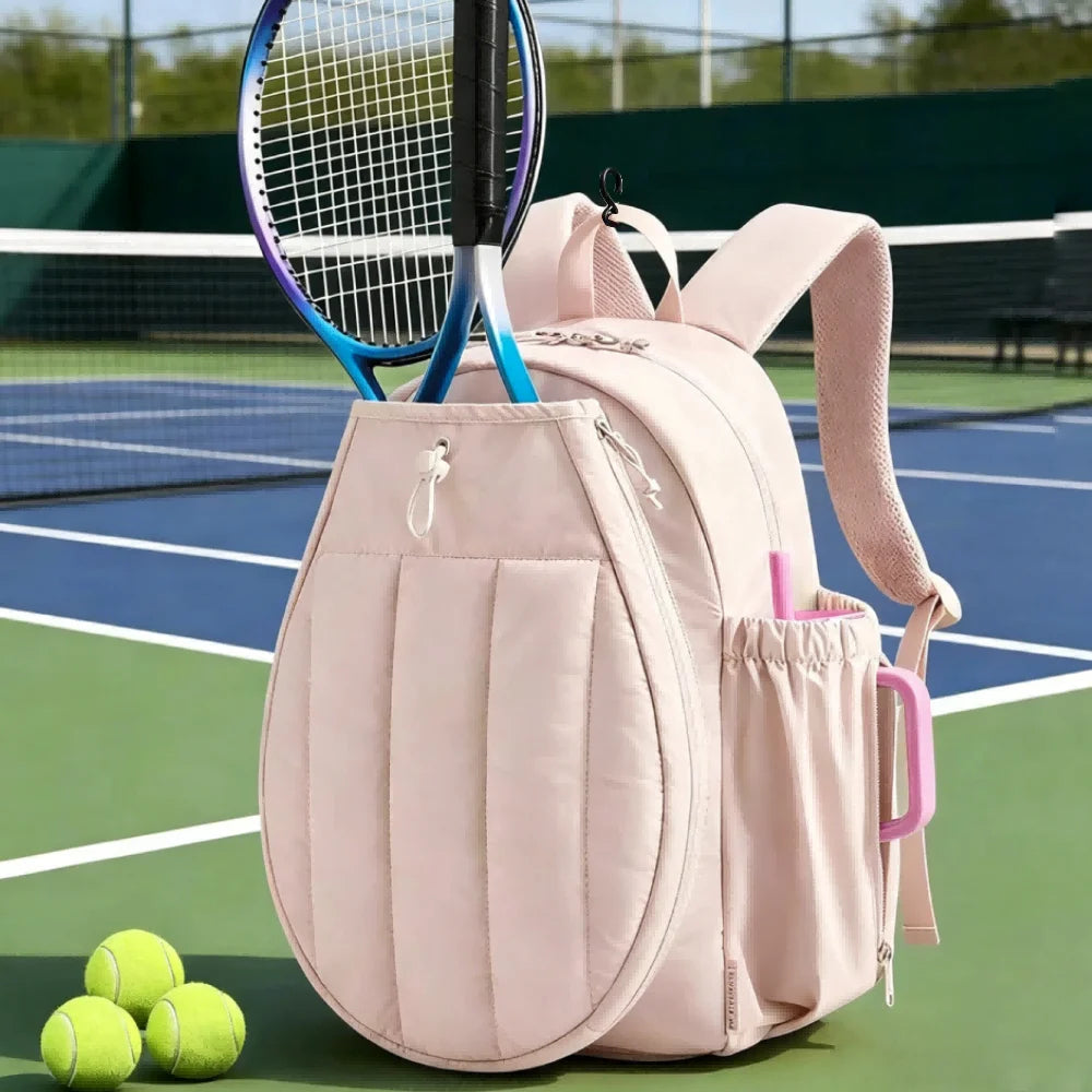 Pink tennis racket sports backpack with multiple compartments, designed by Corporación Turística for tennis players.