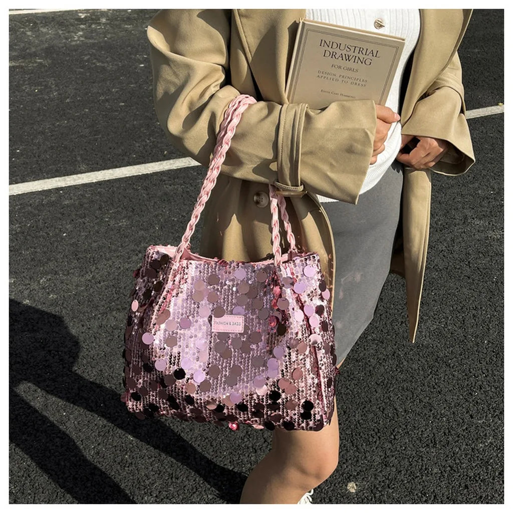 Pink shiny tote bag with sequin embellishments for women, featuring a spacious design and comfortable handles.