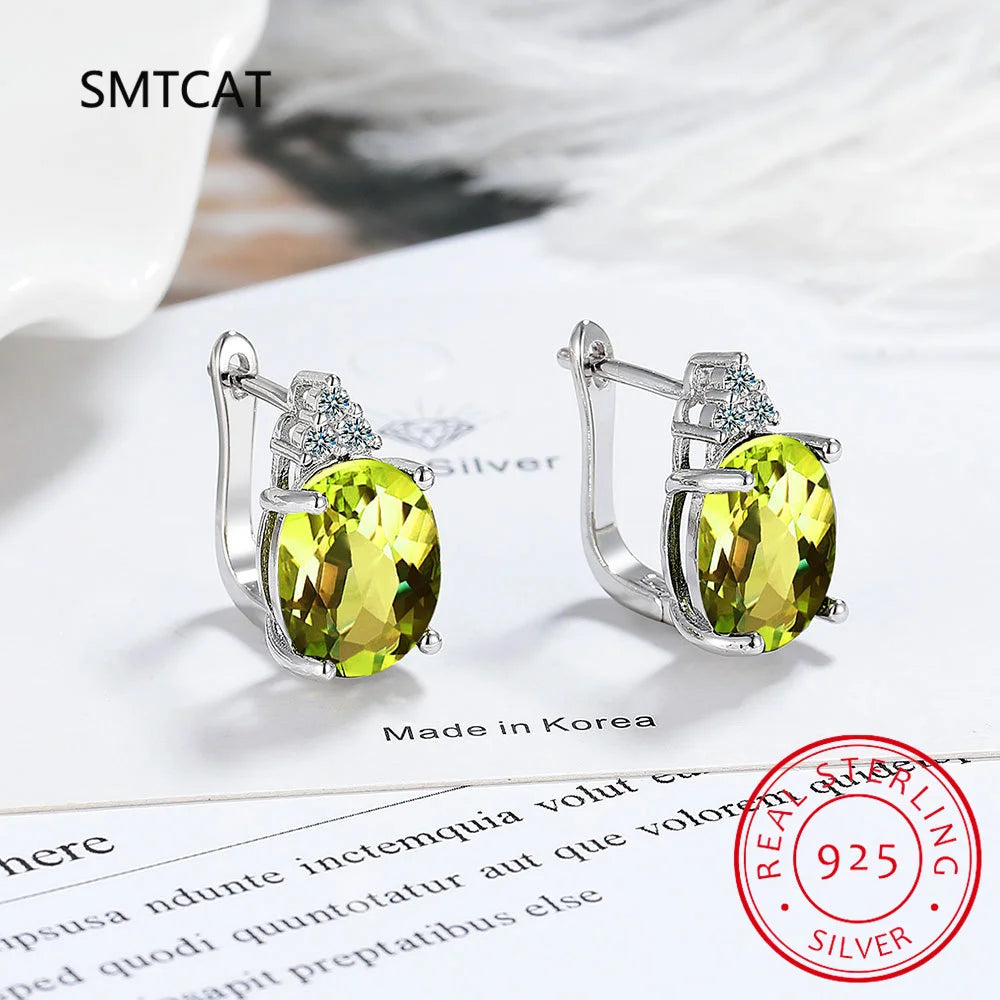 Silver 925 hoop earrings with blue sapphire accents, stylish and elegant jewelry from Corporación Turística.