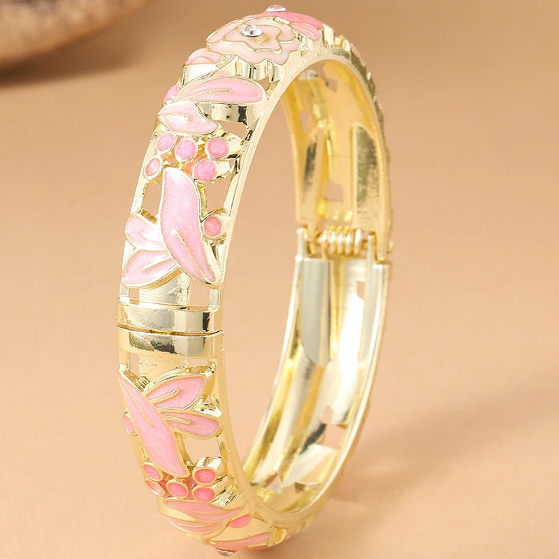 Pink floral enamel bracelet for women by Corporación Turística featuring rose flower designs and colorful accents.