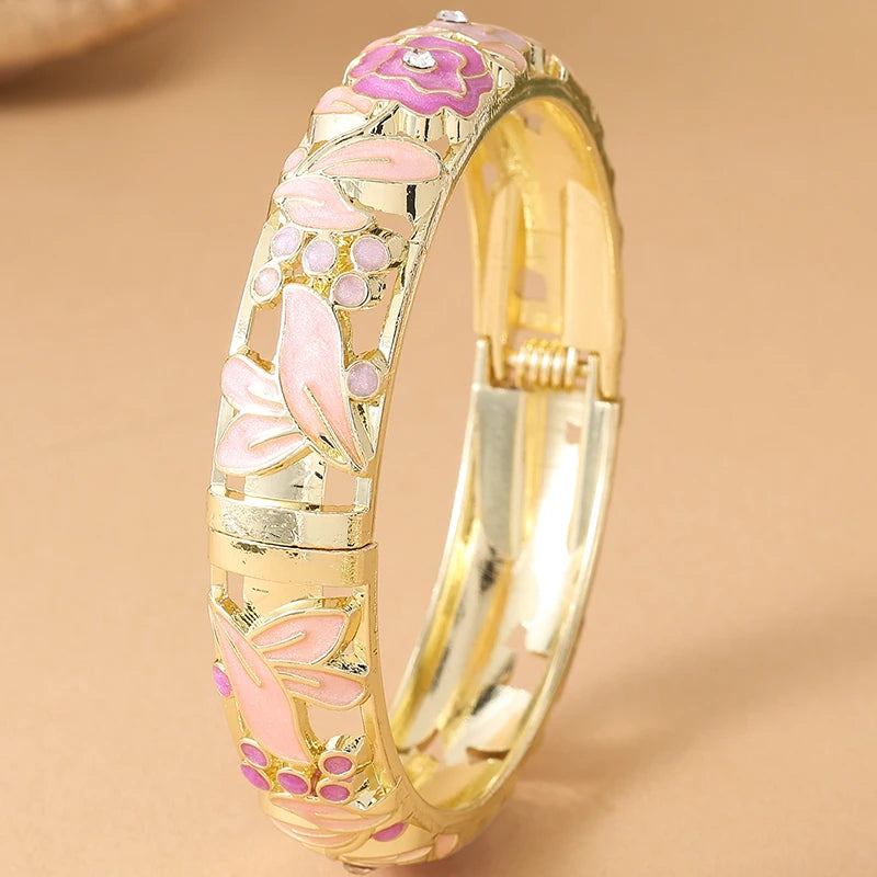 Pink floral enamel bracelet for women by Corporación Turística, featuring rose flower designs and colorful enamel accents.