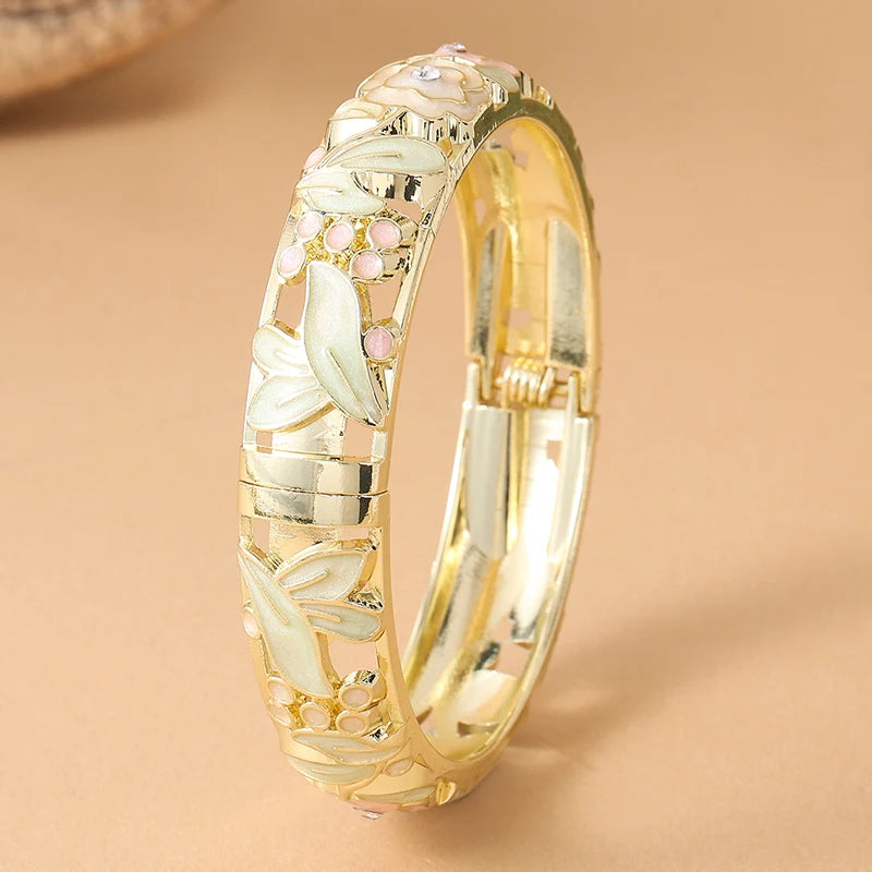 Pink floral enamel bracelet for women with rose flower designs, crafted by Corporación Turística.