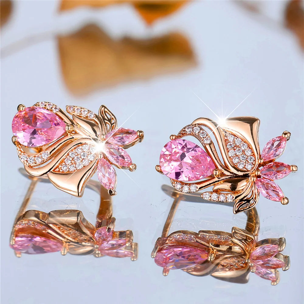 Luxury pink zircon stone hoop earrings from Corporación Turística featuring elegant round hoops with sparkling pink stones.
