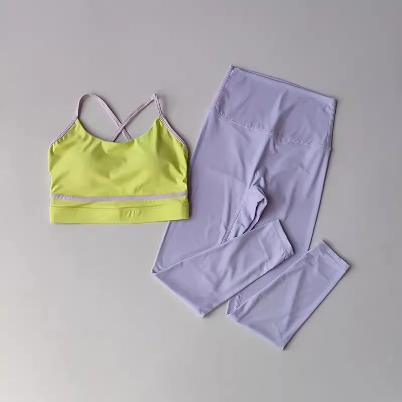 Pink women's yoga set with 2 pieces, including leggings and top, by Corporación Turística, displayed on a mannequin.