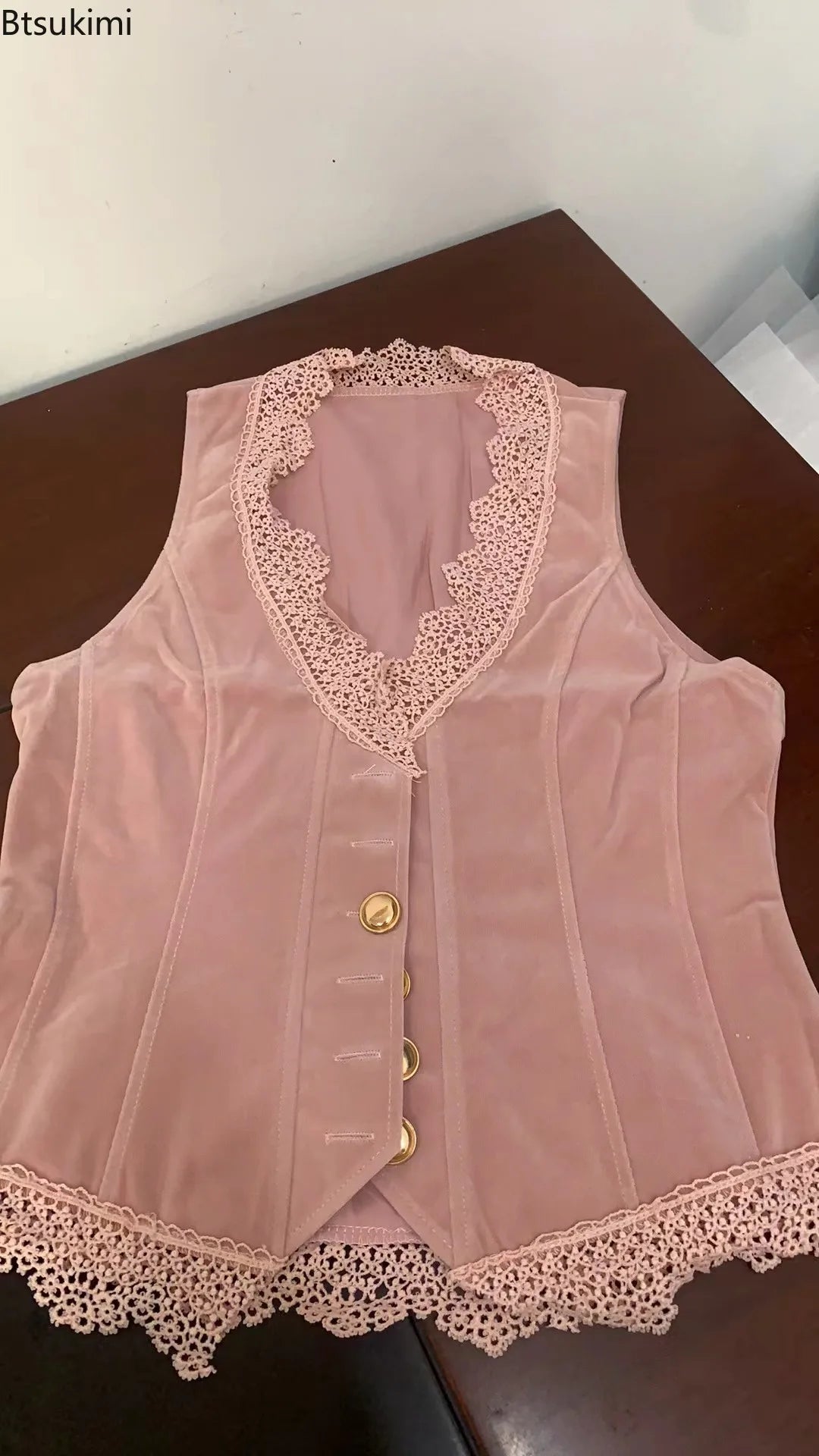 Pink lace women's vest with a collar, featuring a smooth fabric design, from Corporación Turística, size XXL.