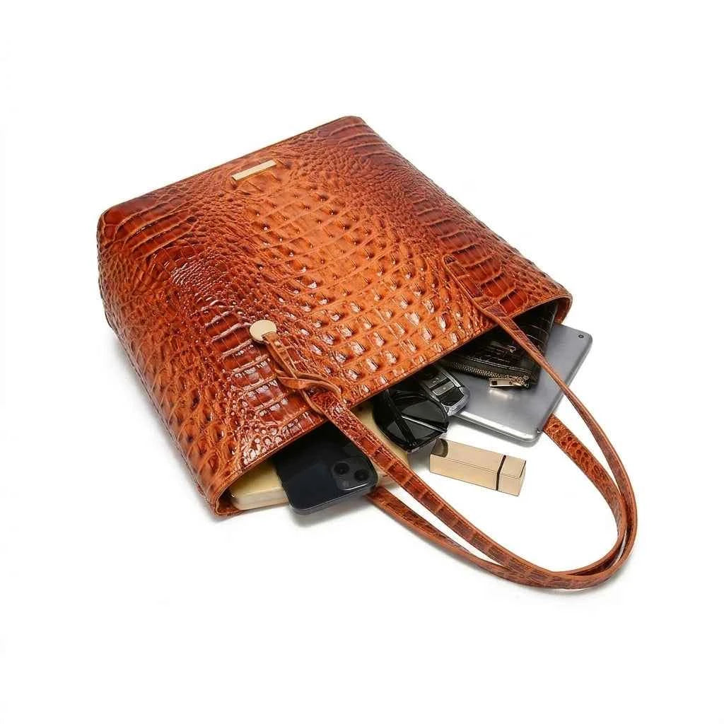 Set of textured relief leather handbags by Corporación Turística, featuring stylish, compact designs for women.