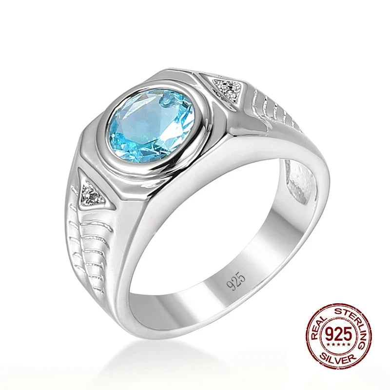 Silver ring featuring blue cubic zirconia and aquamarine gemstones, showcasing elegant jewelry design with sparkling stones.
