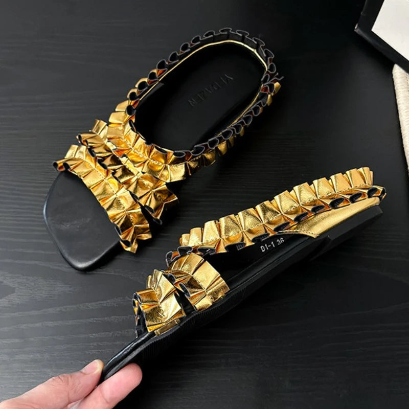 Golden pleated designer sneakers from Corporación Turística, stylish and fashionable sandal footwear for women.