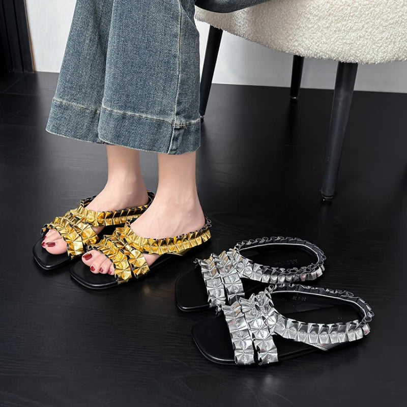 Gold pleated designer sneakers from Corporación Turística featuring a modern, fashionable sandal style and stylish detailing.