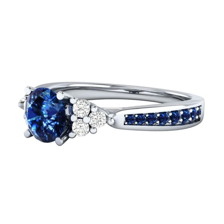 Silver S925 ring featuring a genuine blue sapphire gemstone, detailed close-up of the authentic natural sapphire on the silver band.