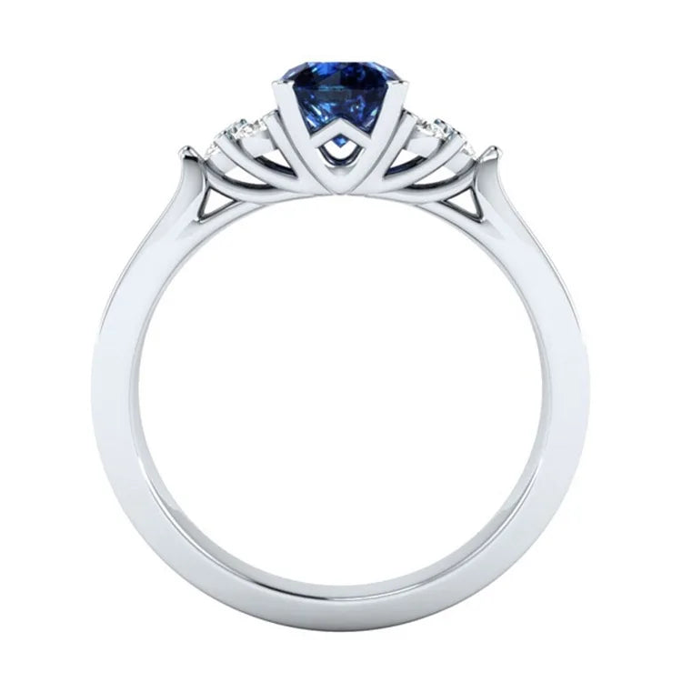 Sterling silver S925 ring with a genuine blue sapphire gemstone, showcasing intricate design and craftsmanship.