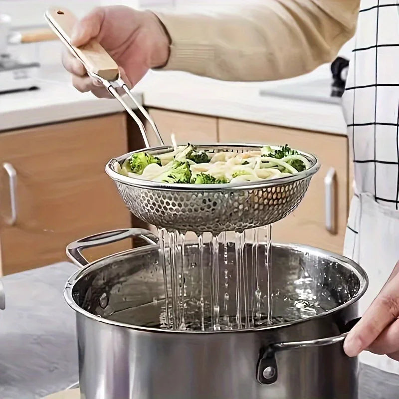 Stainless steel strainer with wooden handle and matching spoon, ideal for kitchen use, by Corporación Turística.