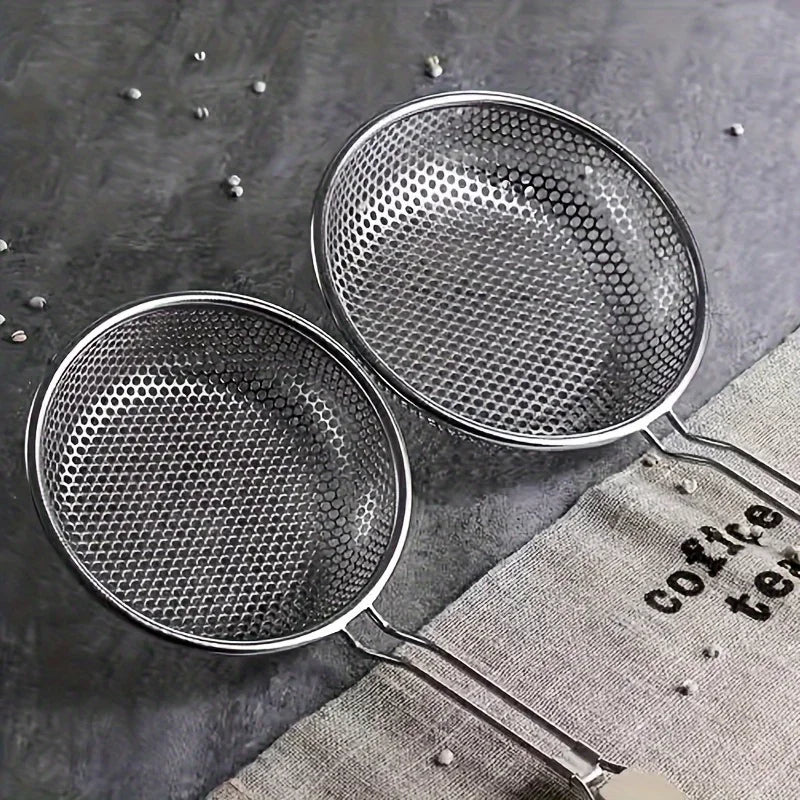 Stainless steel strainer with wooden handle and matching spoon, ideal for kitchen use, by Corporación Turística.