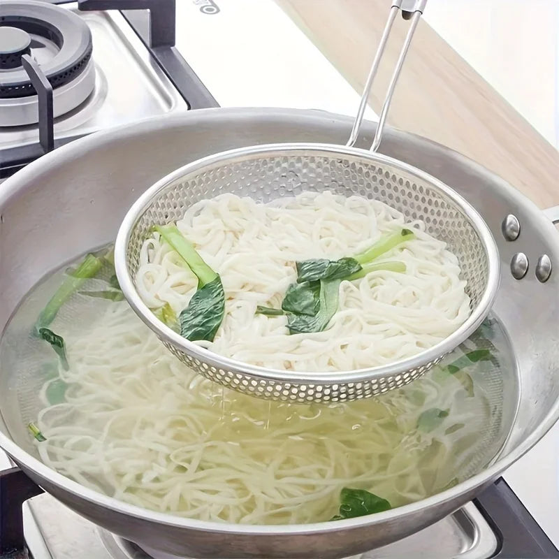 Stainless steel strainer with wooden handle and spoon, perfect for kitchen use by Corporación Turística.