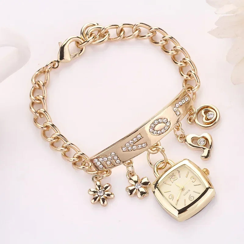 Silver women's letter bracelet watch with chain strap from Corporación Turística, stylish and elegant jewelry accessory.