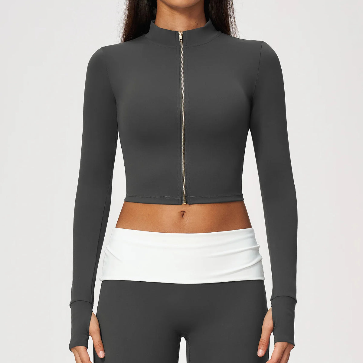 Red women's long-sleeve sports t-shirt with front zipper, from Corporación Turística, featuring a fitted design and breathable fabric.