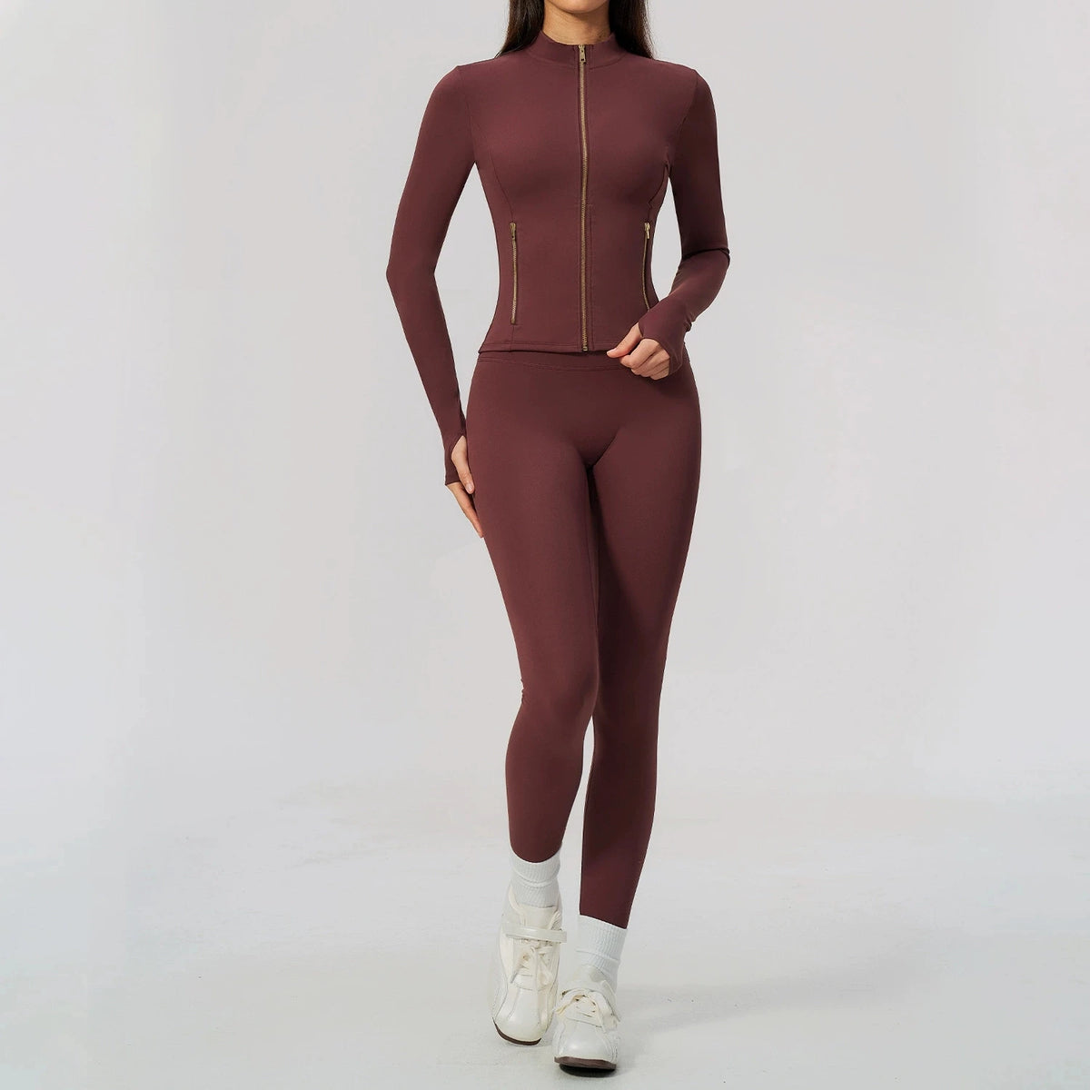 Black women's sports set with yoga top and leggings, from Corporación Turística, ideal for active wear and fitness.