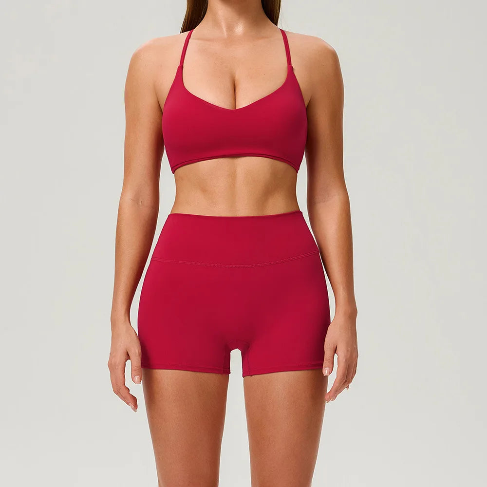 Black 2-piece women's sports set by Corporación Turística, includes a sports top and matching leggings for activewear.