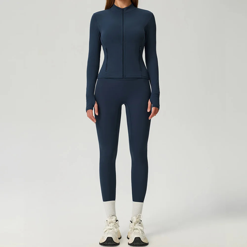 Black 2-piece women's sports set by Corporación Turística featuring a sporty top and matching leggings for active wear.