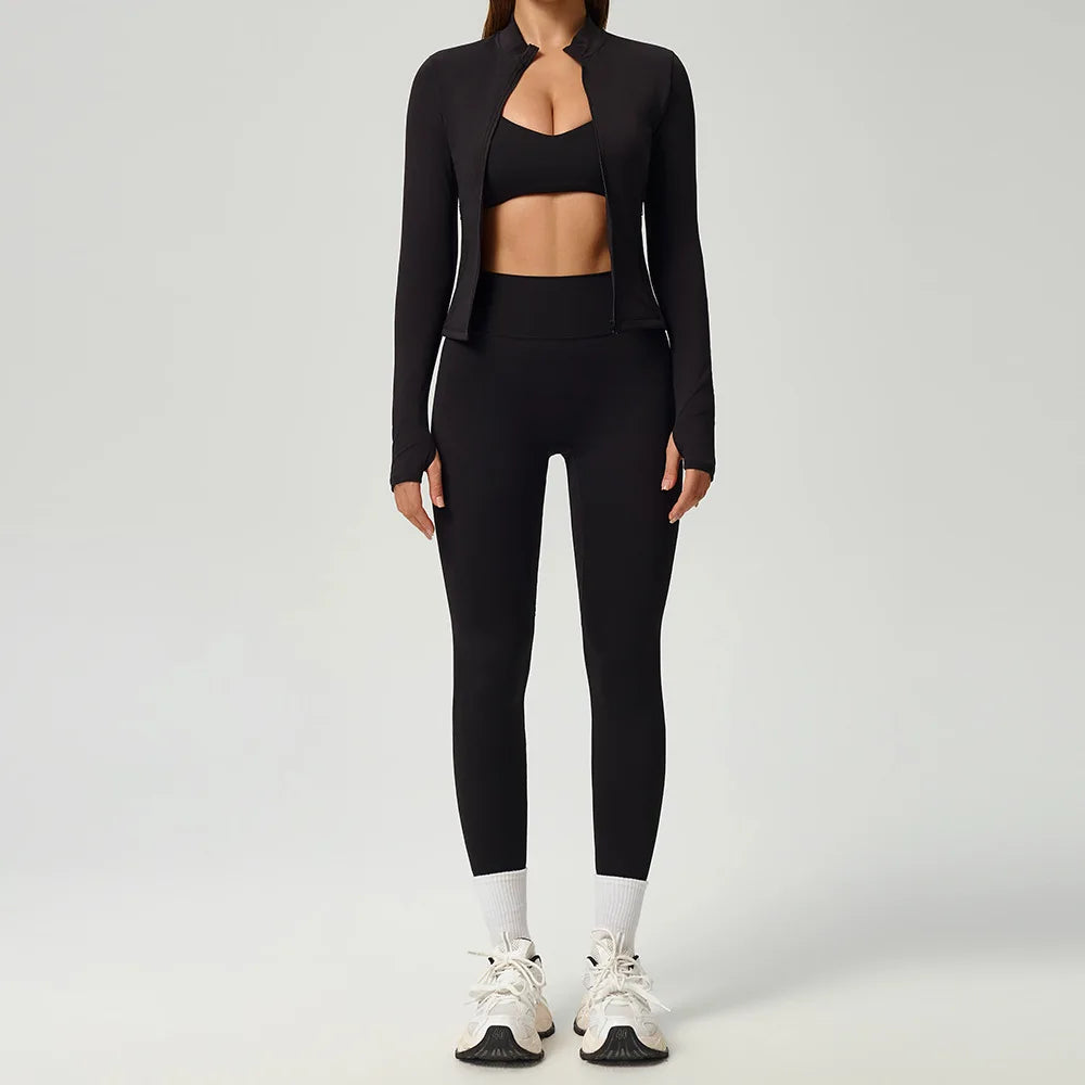 Black 2-piece women's sports set by Corporación Turística featuring a fitted athletic top and matching leggings.