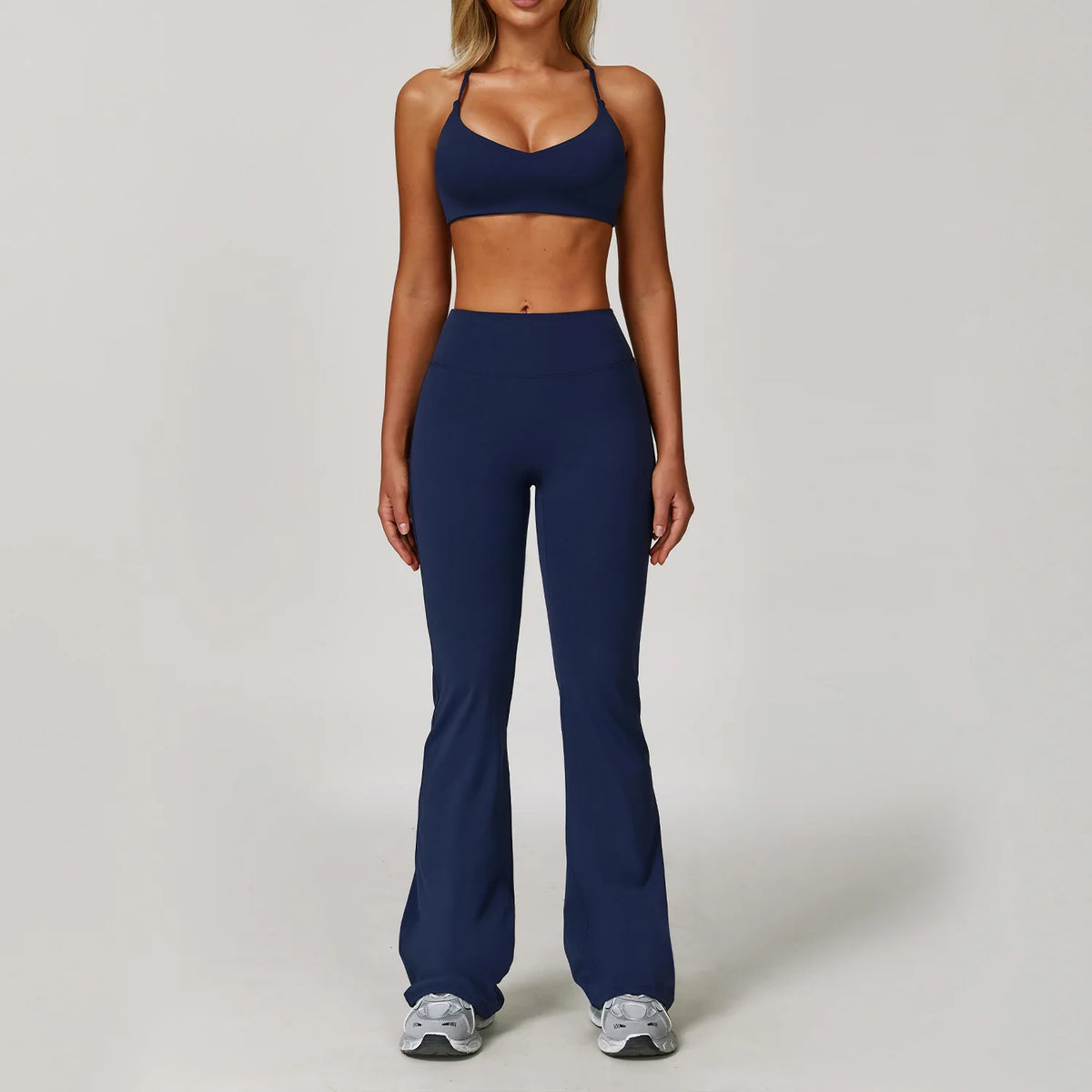 Black 2-piece women's yoga set by Corporación Turística, includes sports bra and leggings for comfortable exercise wear.
