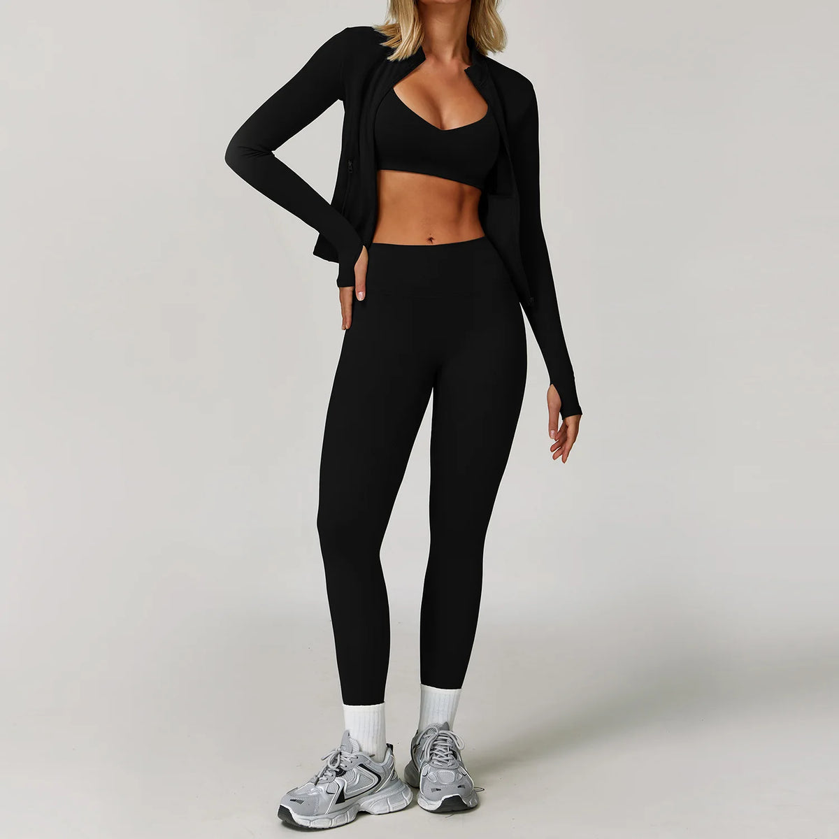 Black 2/3-piece women's yoga set from Corporación Turística featuring a sports bra and leggings, ideal for active wear.