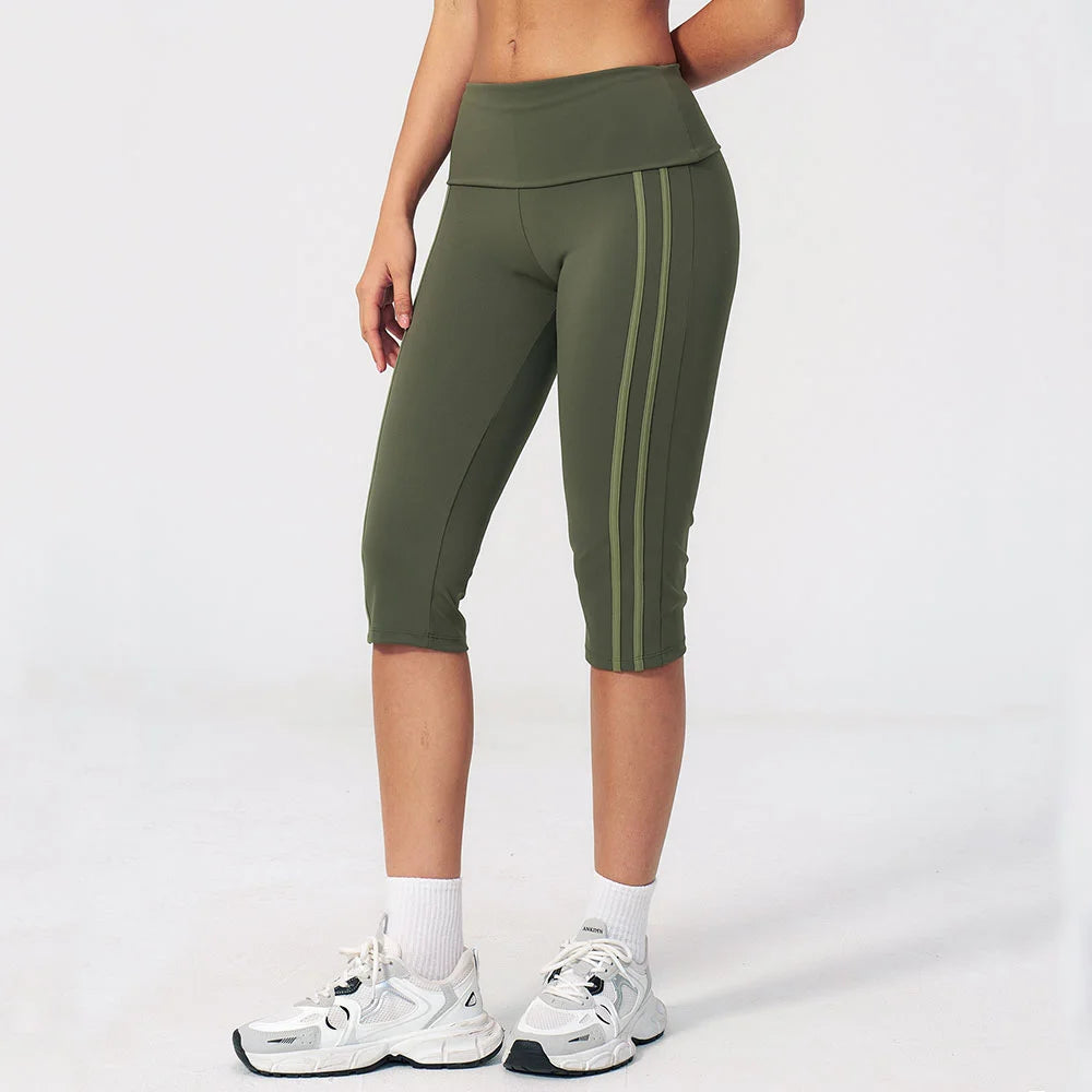 High-waisted yoga pants for women in black by Corporación Turística, shown on a model, featuring a comfortable fit and stretchy fabric.