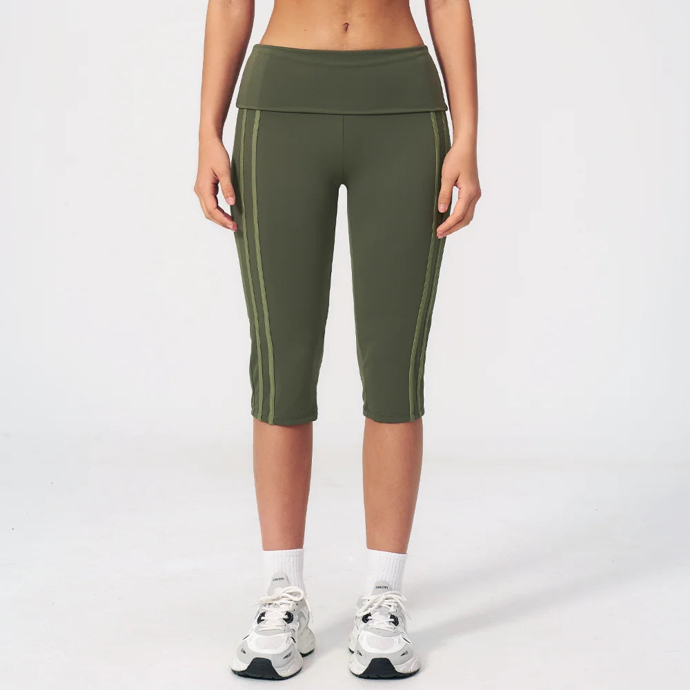 High-waisted black yoga pants for women by Corporación Turística, shown on a model, with a comfortable, stretchy fit for active wear.