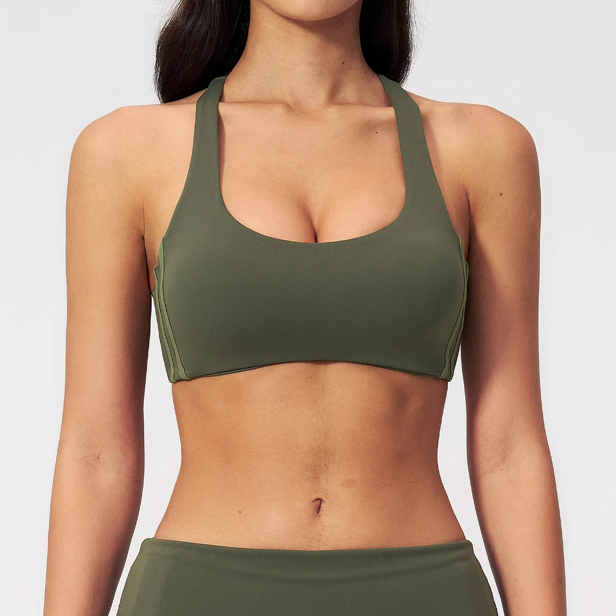 Premium black women's yoga top by Corporación Turística, quick-drying athletic wear for comfortable yoga and active workouts.