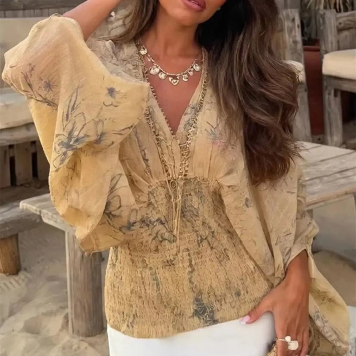 Vintage women's shirt by Corporación Turística with a V-neckline and floral print, featuring a relaxed fit and casual style.