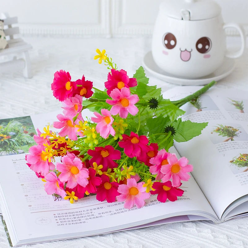 Artificial red Margarita flower bouquet with 28 heads, arranged in a colorful floral display by Corporación Turística.