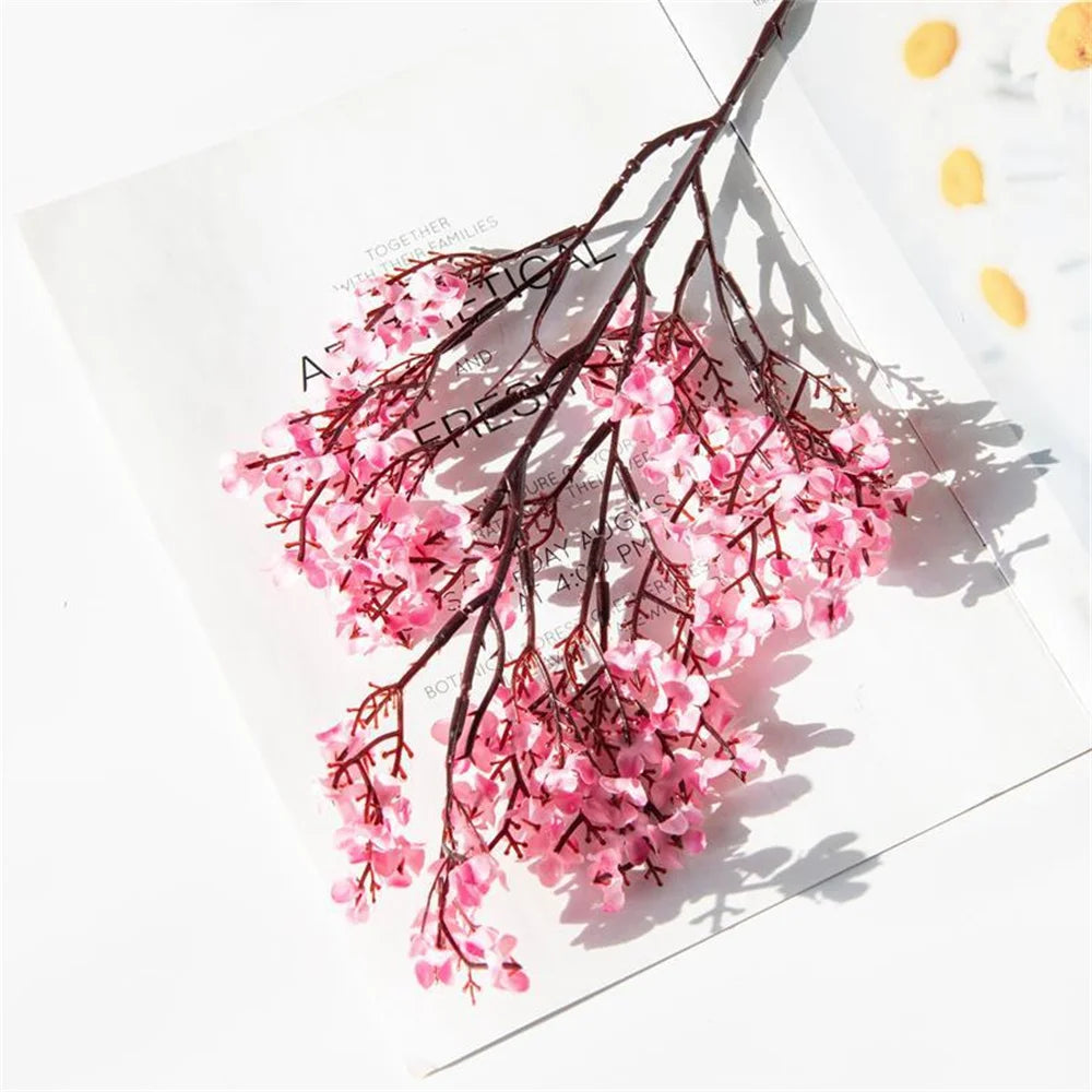 Two purple artificial Gypsophila flowers from Corporación Turística, realistic faux flowers with delicate, airy blooms.