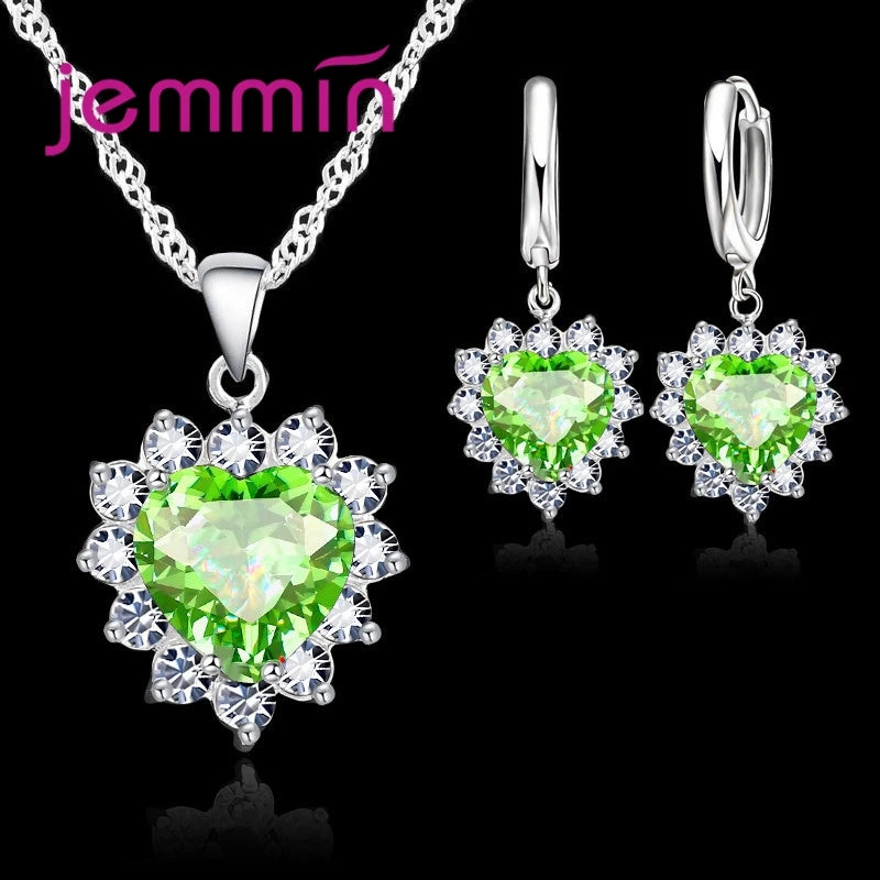 Purple jewelry gift set from Corporación Turística featuring matching necklaces and earrings for special occasions.