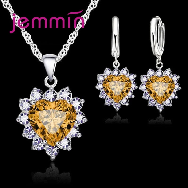 Purple jewelry gift set from Corporación Turística, includes matching necklace and earrings for special anniversary celebrations.