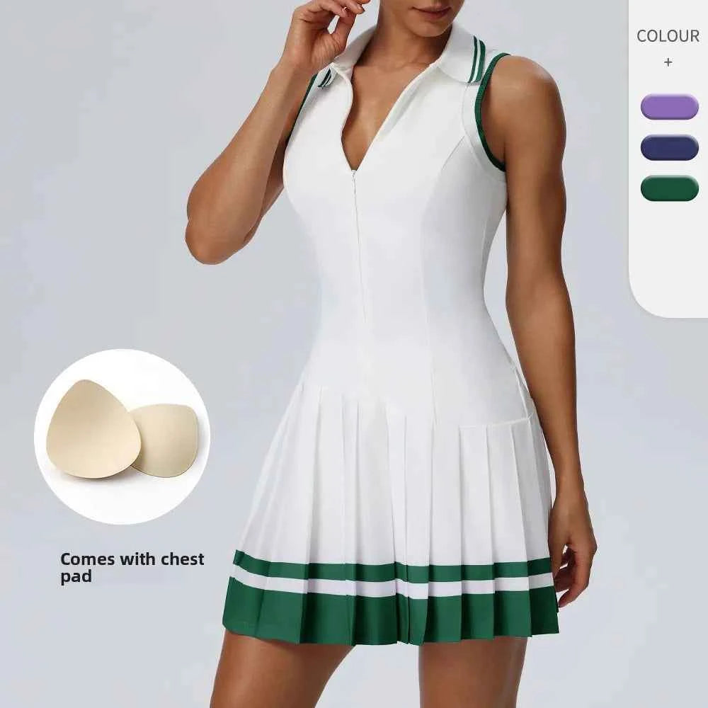 Purple one-piece tennis dress with fold-over collar by Corporación Turística, shown on a model in a sports setting.