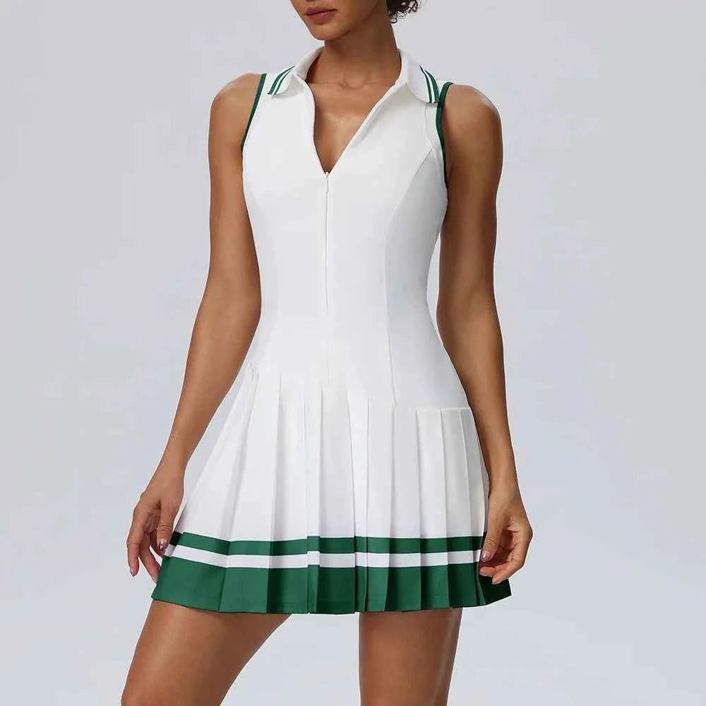 Purple one-piece tennis dress with fold-over collar by Corporación Turística, shown on a model.