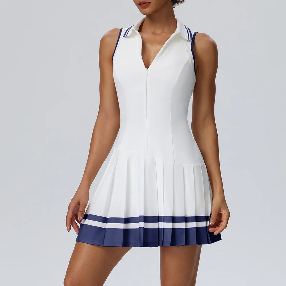 Purple one-piece tennis dress with a fold-over collar by Corporación Turística, designed for athletic comfort and style.