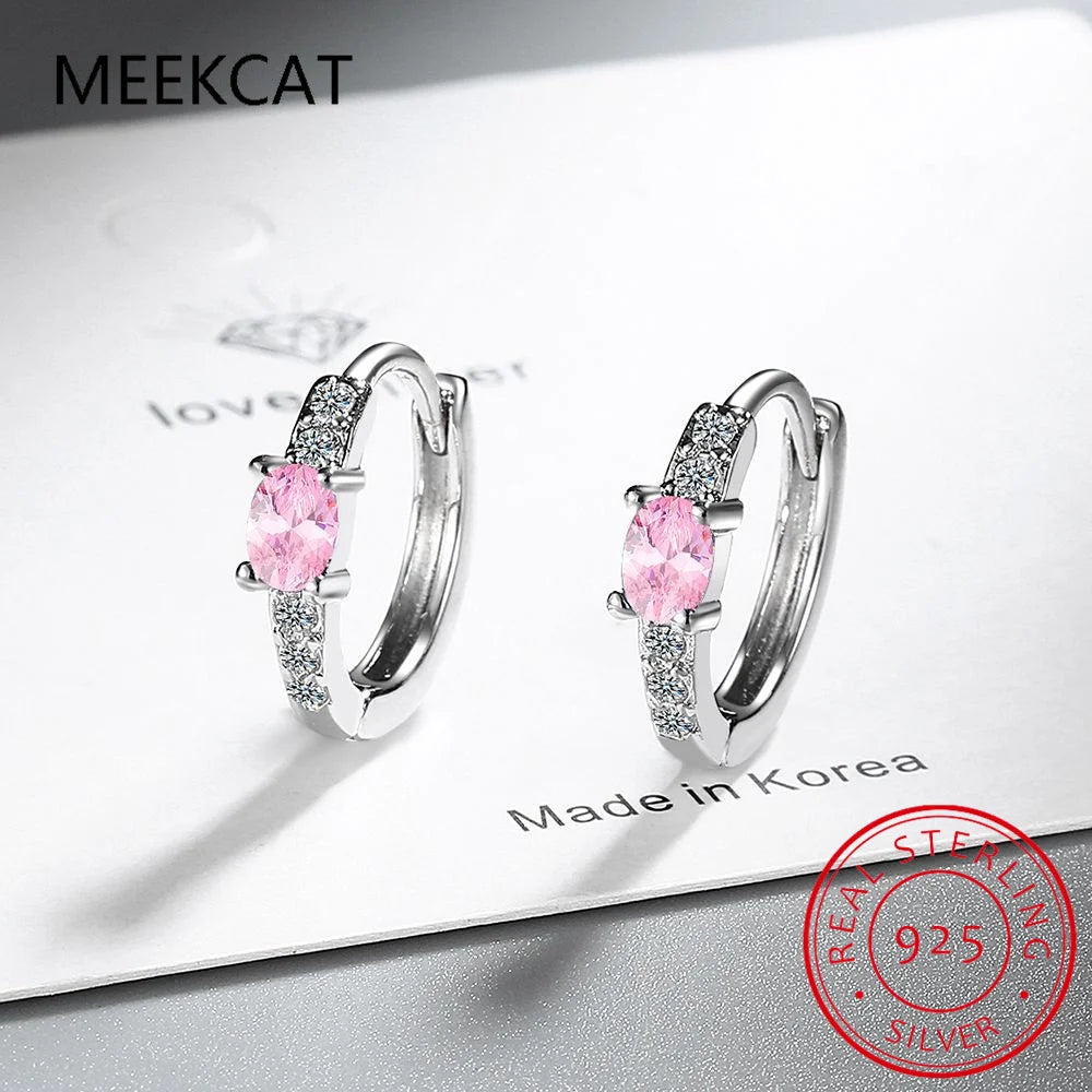 Silver 925 blue sapphire hoop earrings featuring oval-shaped gemstones, crafted by Corporación Turística.