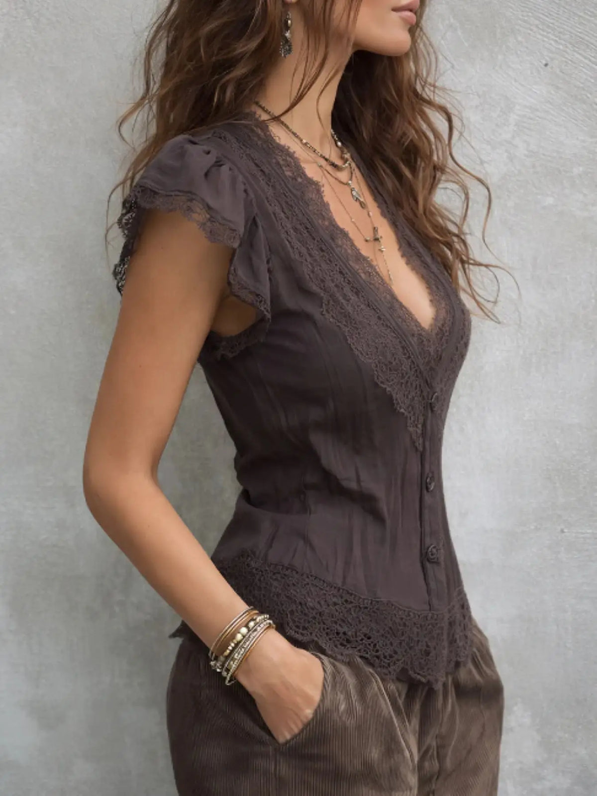 Purple boho blouse for women with deep V-neck, stylish and comfortable, featuring relaxed fit and flowy fabric from Corporación Turística.