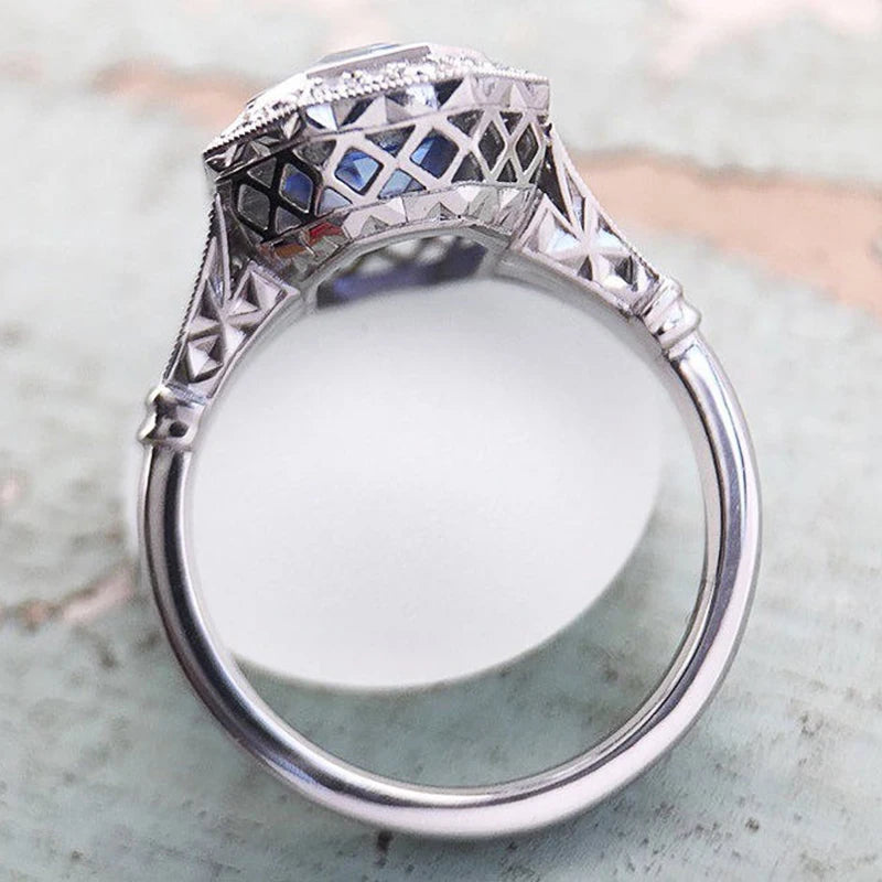 Elegant blue CZ ring for women from Huitan, featuring a stylish design and sparkling gemstone.