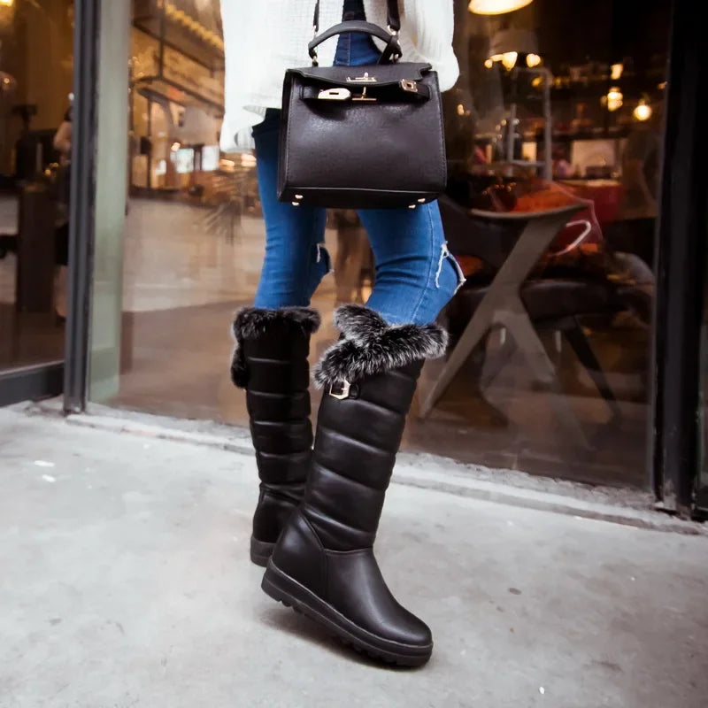 Warm knee-high snow boots with plush fur lining from Corporación Turística, designed for cold weather and snowy conditions.