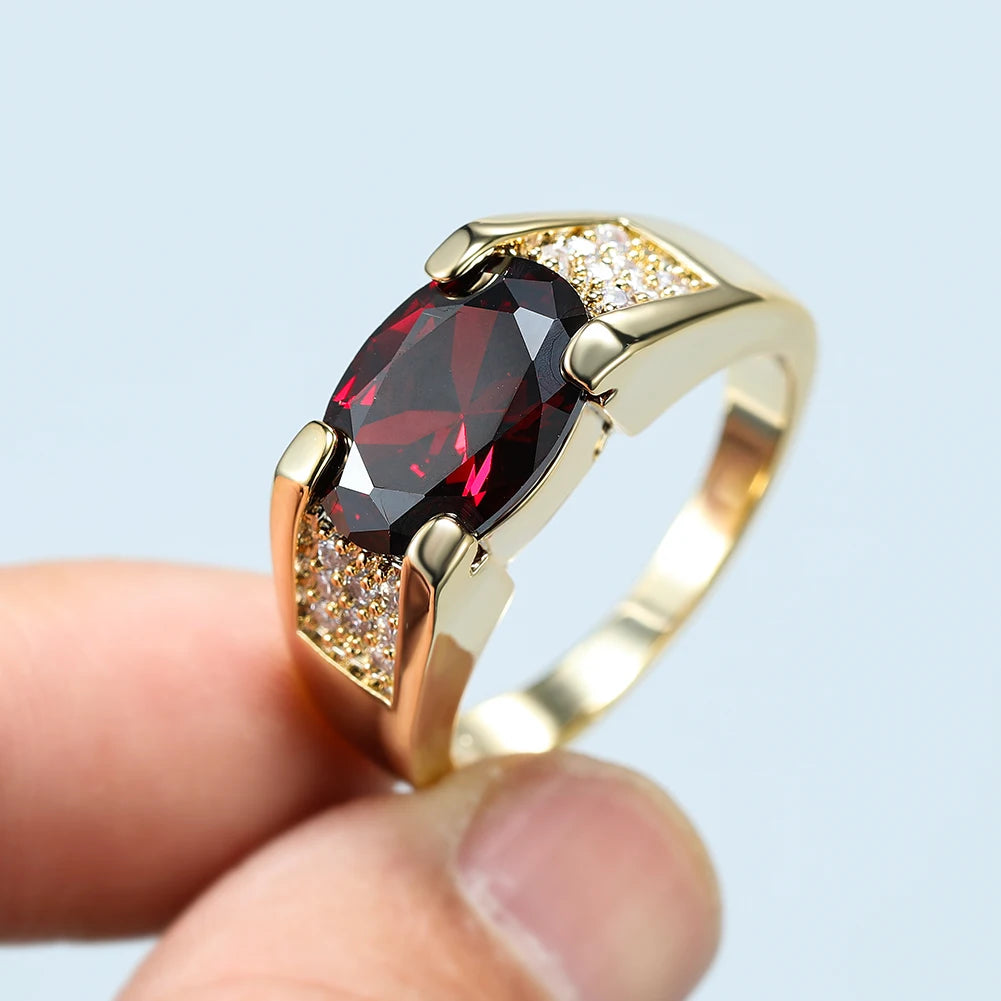 Unisex oval red stone rings by Corporación Turística, featuring vibrant red gemstones in a stylish design for men and women.