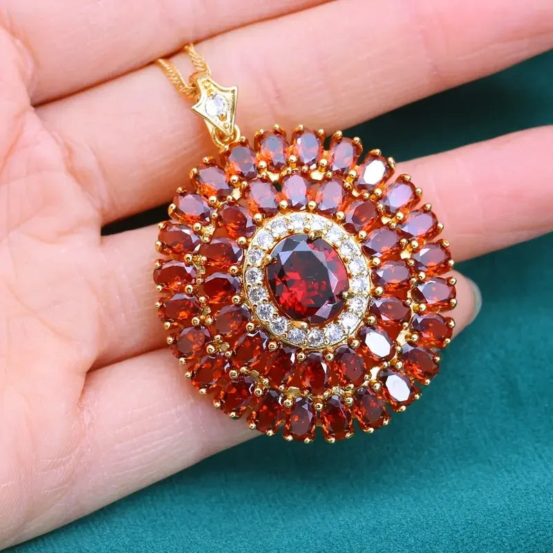 Elegant red cubic zirconia pendant necklace featuring a sleek chain, designed by Corporación Turística.