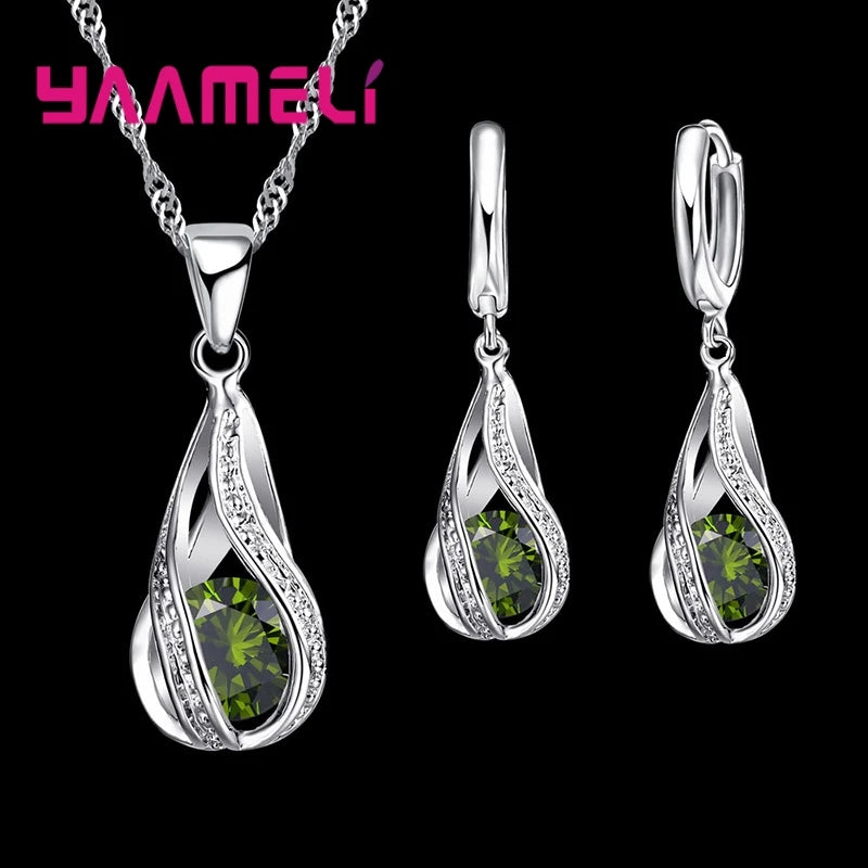 Red hot water drop CZ 925 jewelry set by Corporación Turística, including necklace and earrings with gold plating.