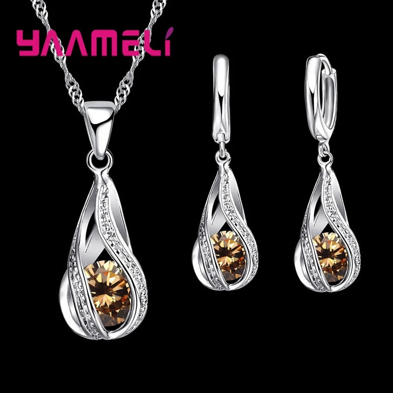 Gold-plated CZ 925 jewelry set featuring a water droplet design, with matching earrings and necklace, from Corporación Turística.