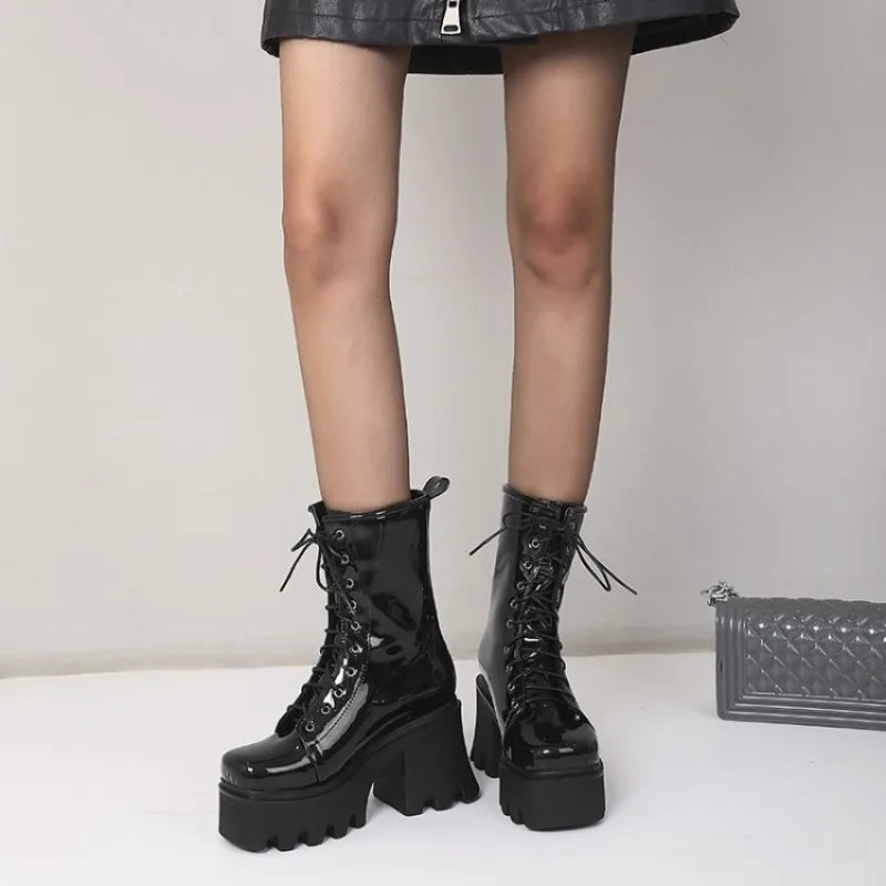 Red gothic punk boots for women by LeShion of Chanmeb, featuring a chunky heel and edgy design, made by Corporación Turística.