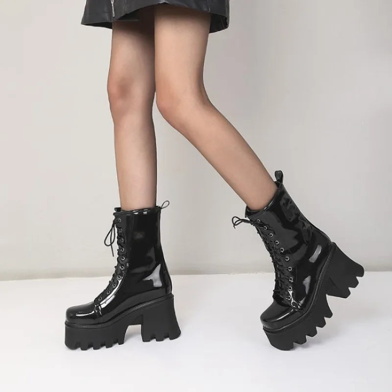 Red gothic punk ankle boots for women by LeShion of Chanmeb, featuring a pointed toe and chunky heel.