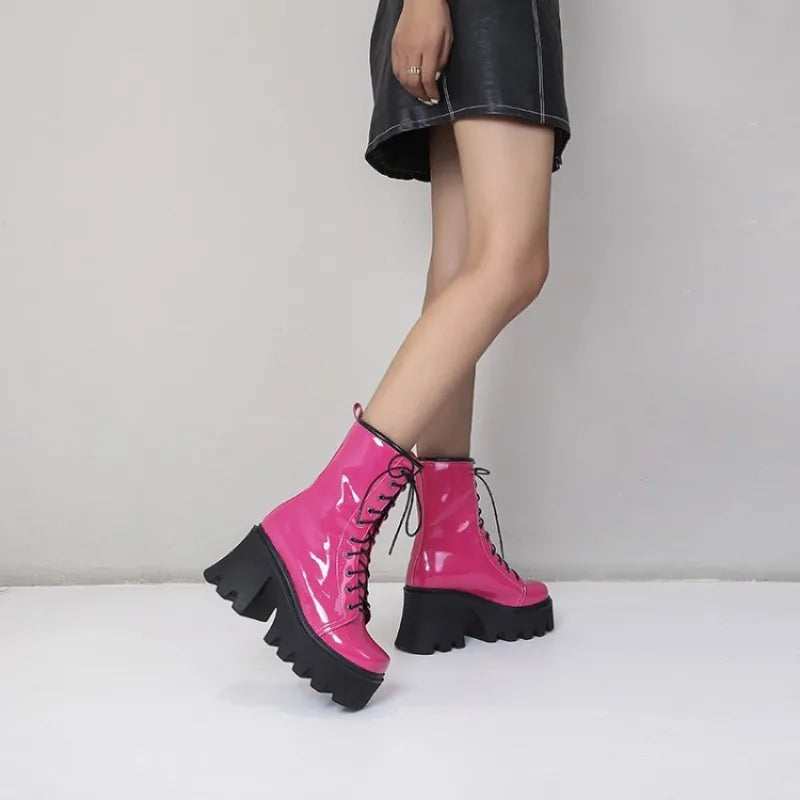 Black gothic punk women's boots by LeShion of Chanmeb, featuring chunky heels and edgy design, made by Corporación Turística.