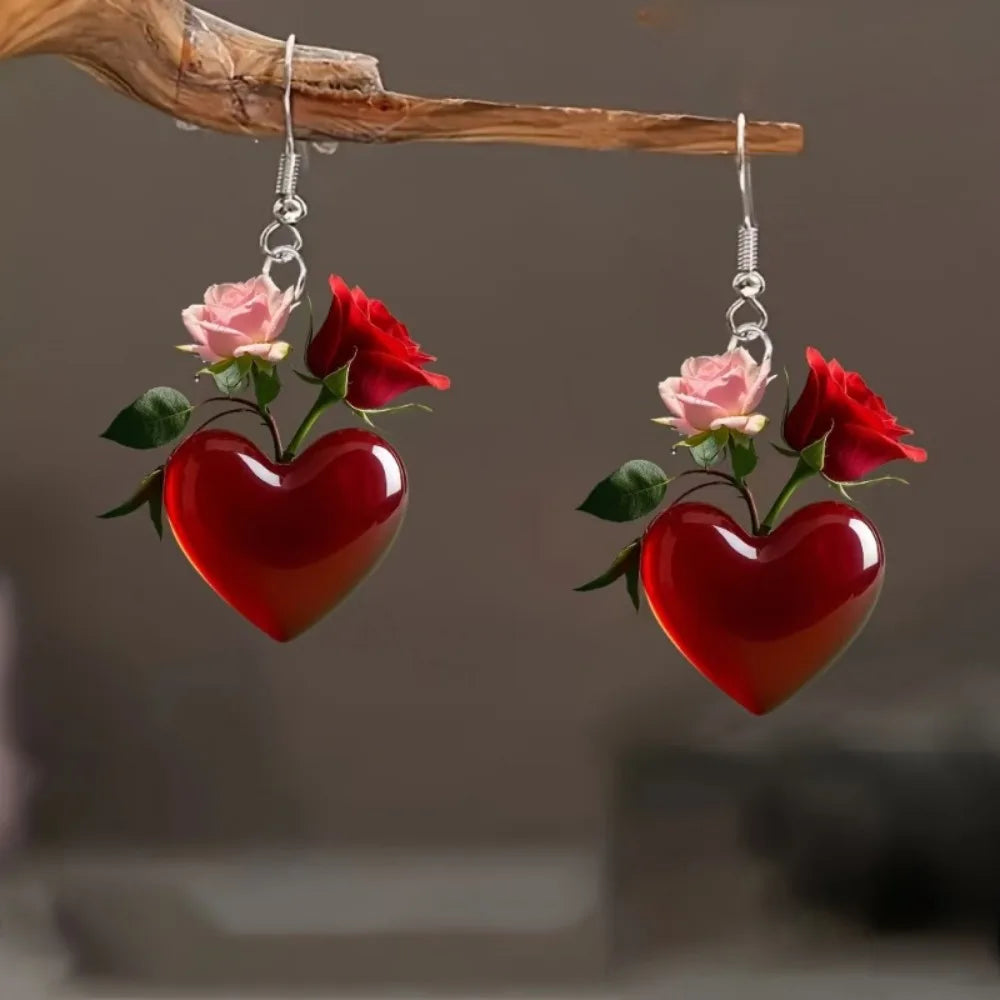 Acrylic heart-shaped dangling earrings from Corporación Turística, featuring vibrant red, stylish jewelry for women.