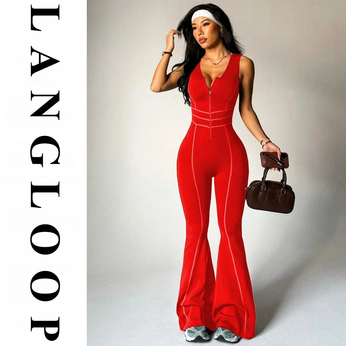 Sleeveless yoga jumpsuit with back cutout by Corporación Turística, shown in red, designed for comfortable workout wear.